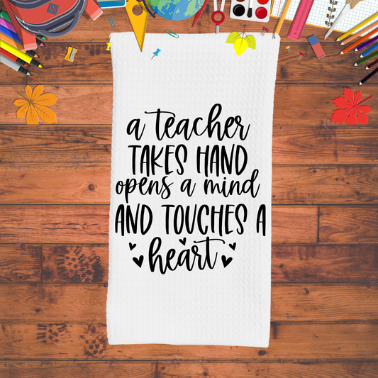 A teacher takes hand opens a mind and touches a heart