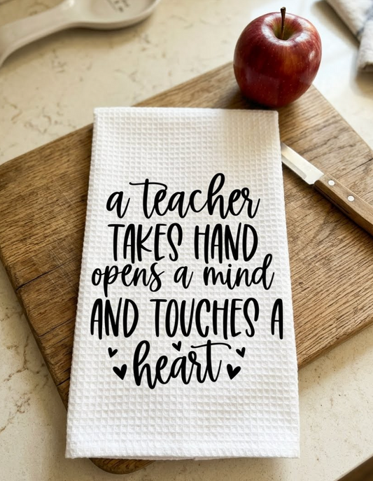 A teacher takes hand opens a mind and touches a heart